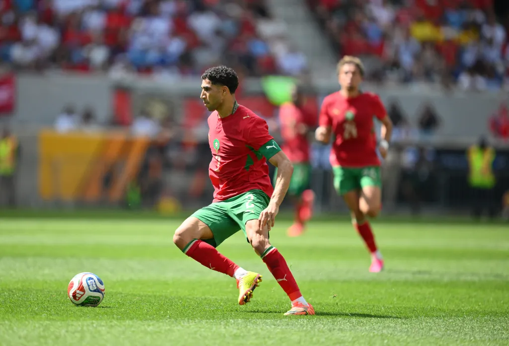 Morocco's defender Achraf Hakimi running with the ball during a friendly football match against Norway.