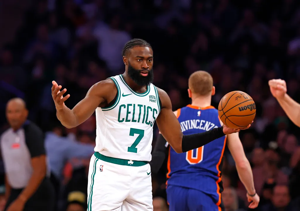 Jaylen Brown of the Boston Celtics holding a basketball.