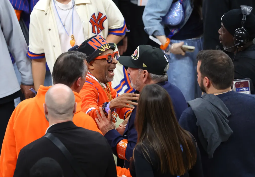 Spike Lee greets New York Knicks owner James Dolan on the floor at the end of the fourth quarter.