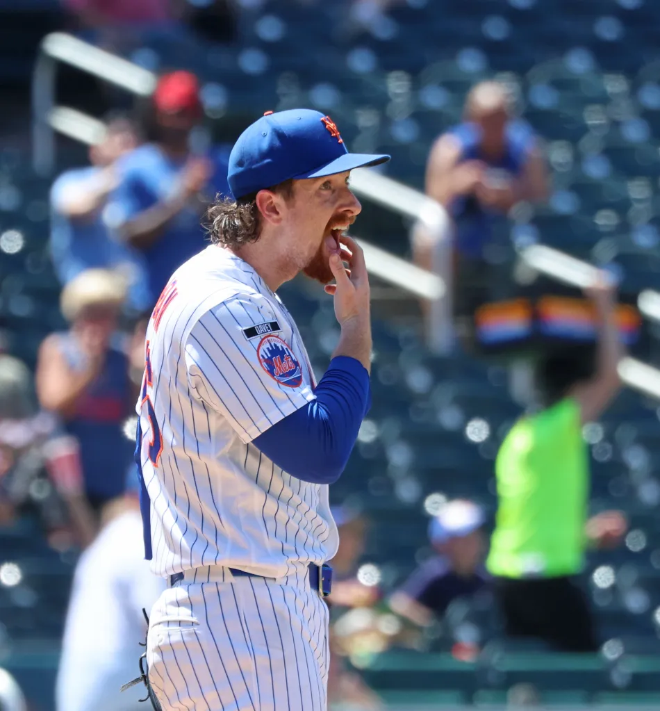 Nolan McLean #26 reacts after Chicago Cubs first baseman Michael Busch #29 hits a two run home run during the fifth inning.
