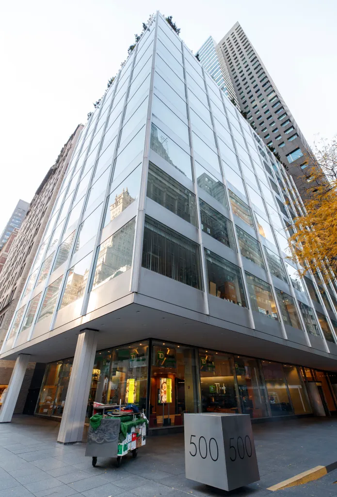The corner of the glass-facade 500 Park Avenue building in Manhattan, with a TD Bank branch on the ground floor.