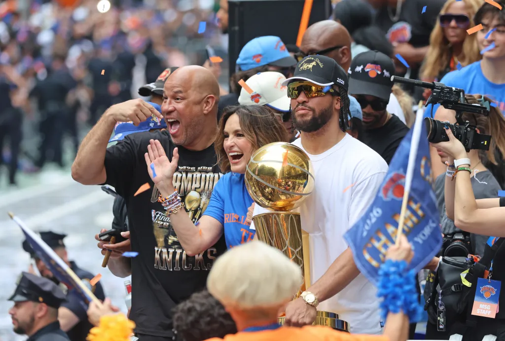 Jalen Brunson #11, Mariska Hargitay, and Rick Brunson celebrating the New York Knicks' 2026 NBA championship.