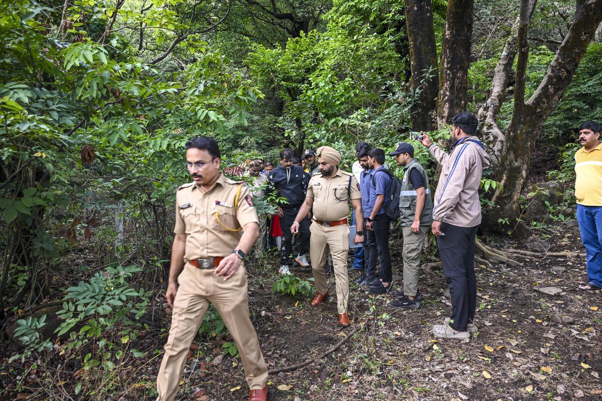 Pune Rural Police SP Sandeep Singh Gill along with the forensic team at Lohagad Fort, at the spot where the body of Ketan Agarwal was found.