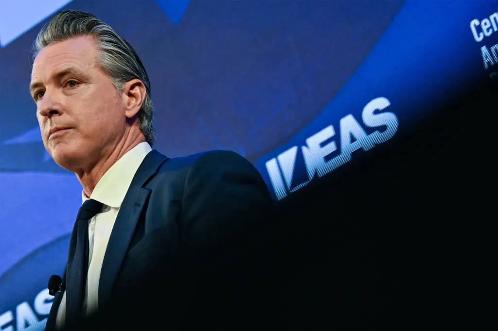 Gavin Newsom delivering a speech at a conference.