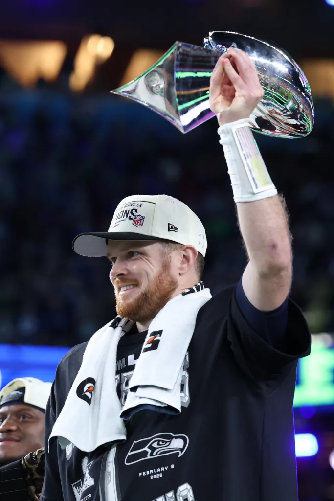 Sam Darnold of the Seattle Seahawks celebrates with the Vince Lombardi Trophy after winning Super Bowl LX.