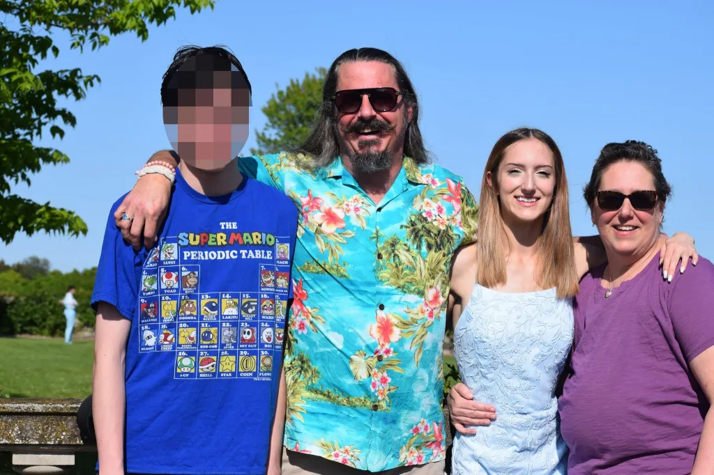 Garin Kueker, Paul Kueker, Khloe Kueker, and Kristen Lomme Kueker posing for a photo.