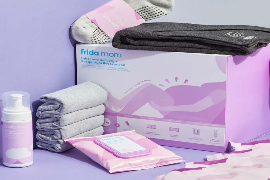Frida Mom 11-piece Postpartum Essentials Kit with various recovery products.