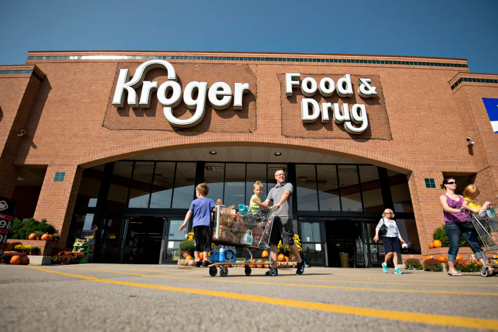 Shoppers exiting a Kroger supermarket in Peoria, Illinois.