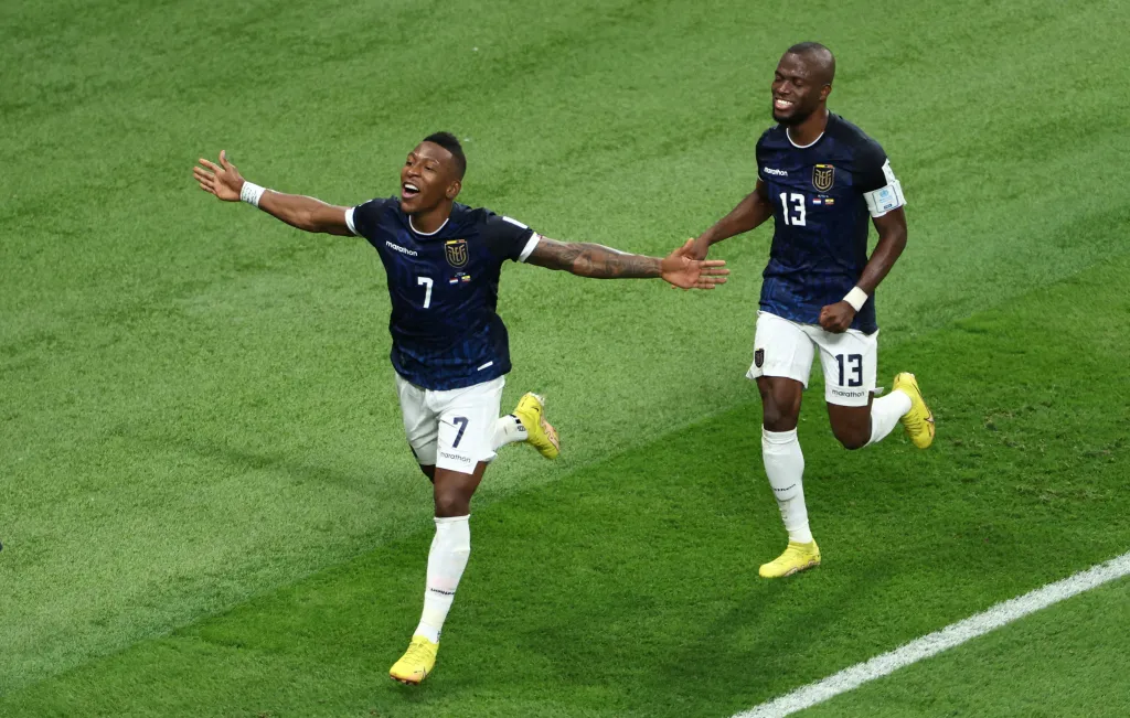 Ecuador's Pervis Estupinan celebrates a disallowed goal with Enner Valencia.