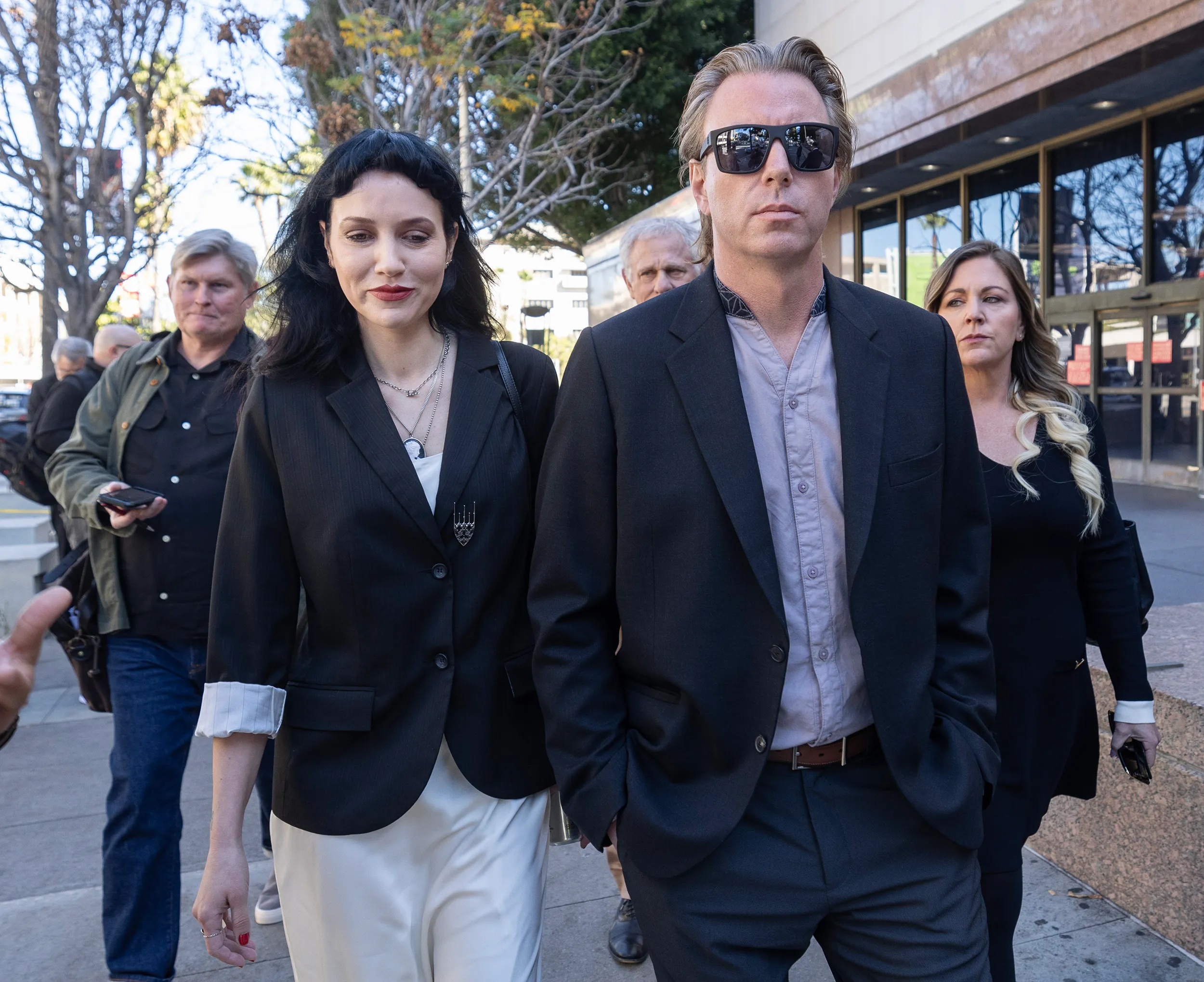 Elijah Blue Allman and Marieangela King leave a courthouse with their lawyers.