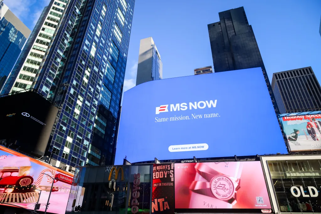 An "MS NOW" billboard in Times Square announces the MSNBC rebranding.
