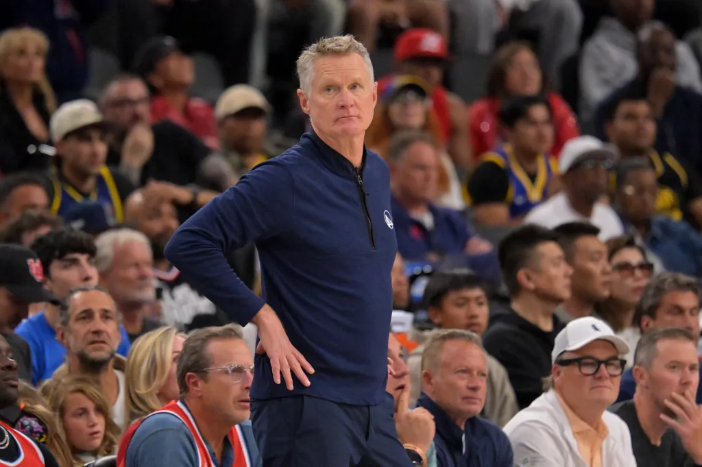 Steve Kerr, head coach of the Golden State Warriors, stands on the sideline during a game.