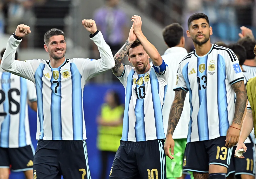 Argentina's Lionel Messi, Rodrigo De Paul, and Cristian Romero celebrate after the FIFA World Cup 2026 match.