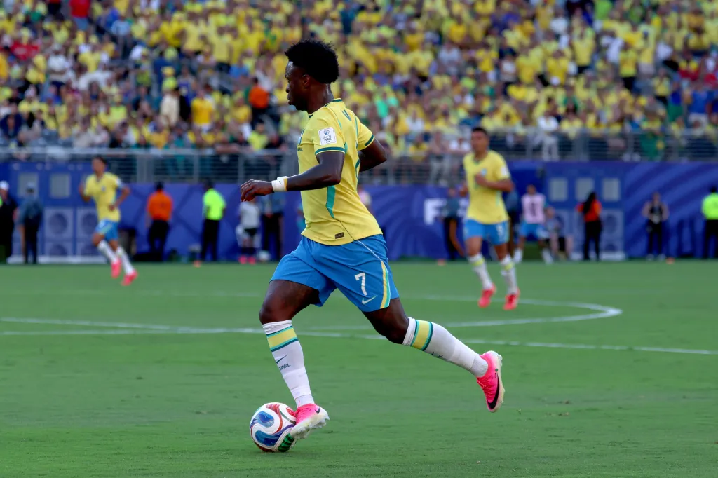 Brazilian forward Vinícius Júnior, wearing No. 7, dribbles the ball during the 2026 FIFA World Cup Group C match between Brazil and Morocco.
