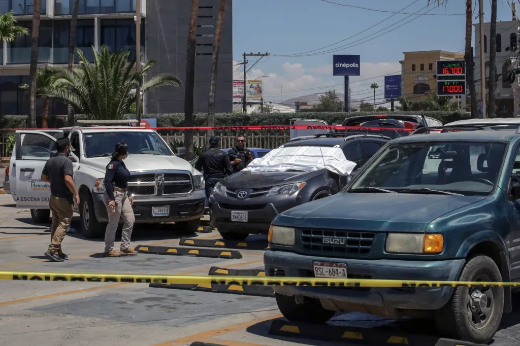 cars at a crime scene with police tape
