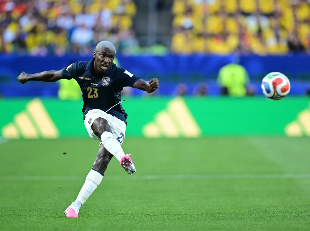 Moises Caicedo of Ecuador kicking a soccer ball during a FIFA World Cup 2026 match against Ivory Coast.