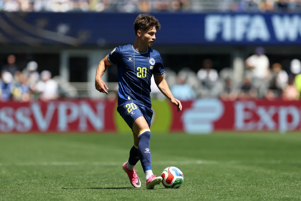 Esmir Bajraktarevic #20 of Bosnia and Herzegovina dribbles the ball during a FIFA World Cup 2026 match.