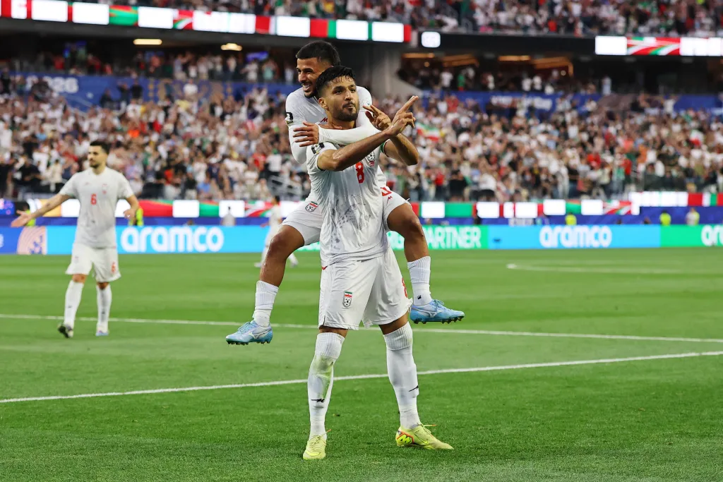 Mohammad Mohebbi celebrates his second goal with Mehdi Ghayedi at the FIFA World Cup 2026.