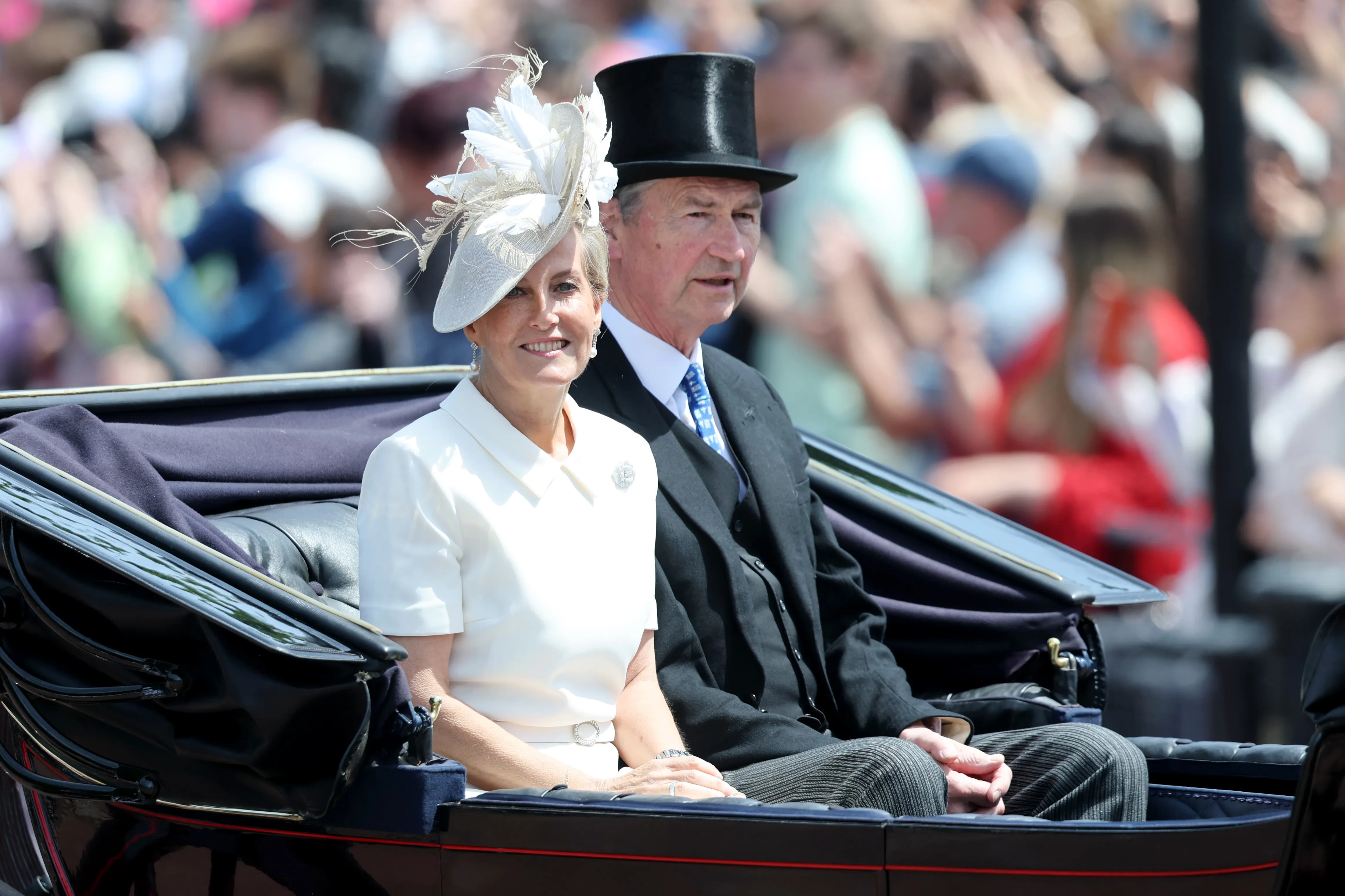 Sophie, Duchess of Edinburgh and Vice Admiral Sir Timothy Laurence pass through the Trooping The Colour parade.