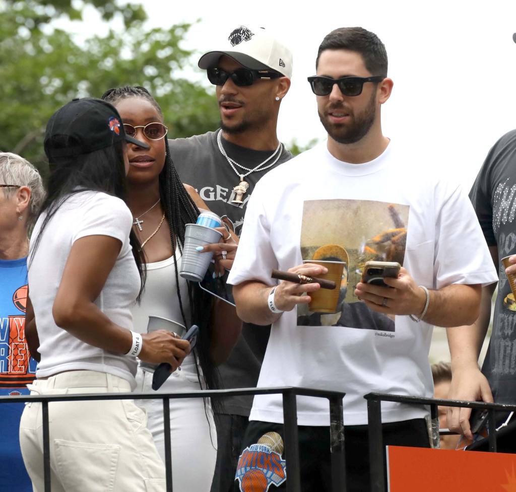Josh Hart and people on a float during the 2026 NBA Champions New York Knicks Ticker Tape Parade.
