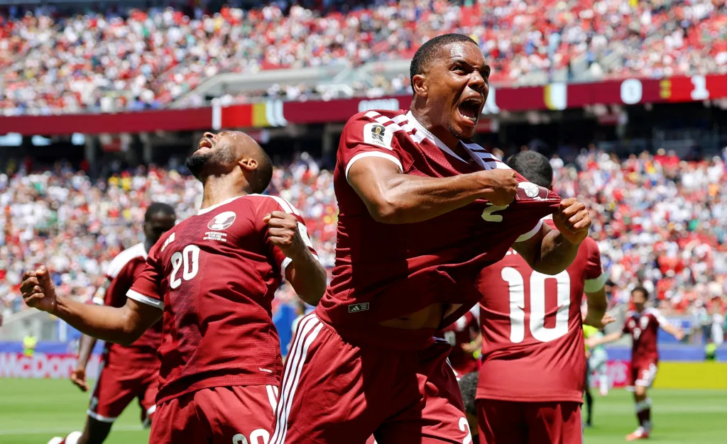Pedro Miguel celebrates after Boualem Khoukhi scored a goal for Qatar.