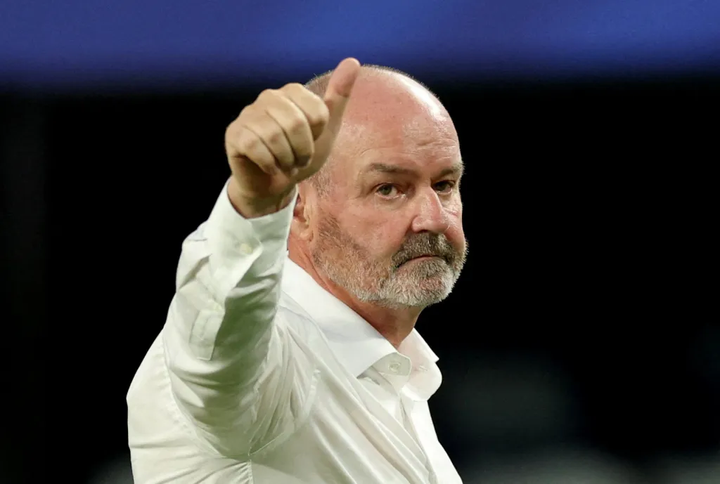 Scotland manager Steve Clarke gives a thumbs-up gesture at the end of the match.