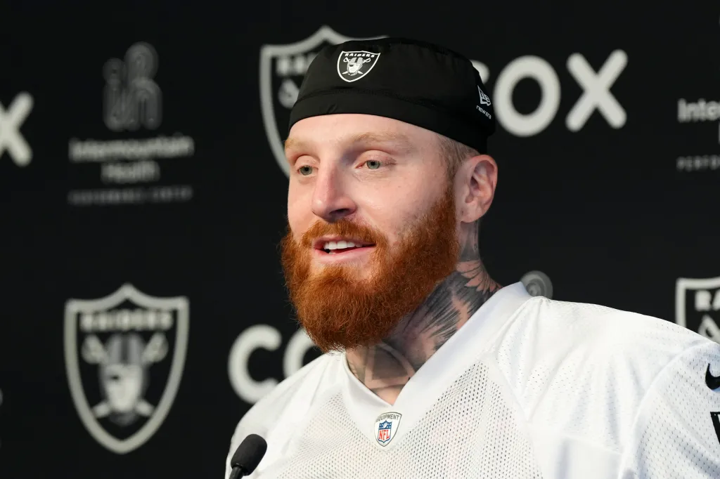 Maxx Crosby speaking at a press conference.