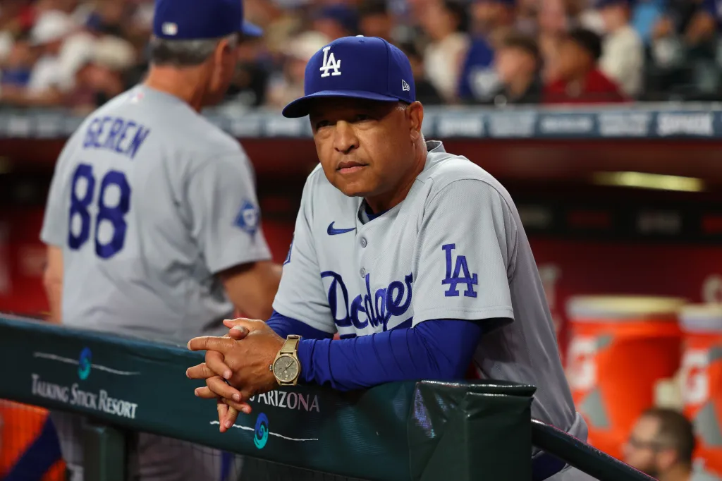 Dave Roberts watching the MLB game between the Los Angeles Dodgers and Arizona Diamondbacks.