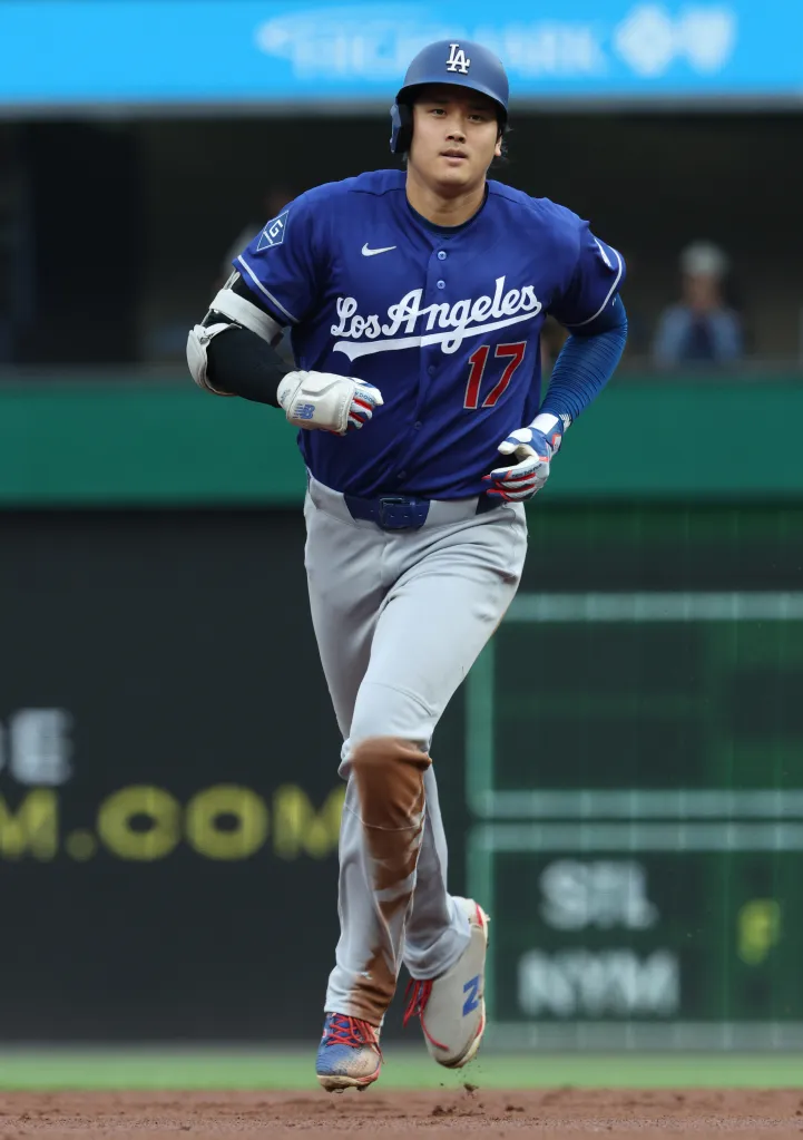 Shohei Ohtani of the Los Angeles Dodgers running on the field.