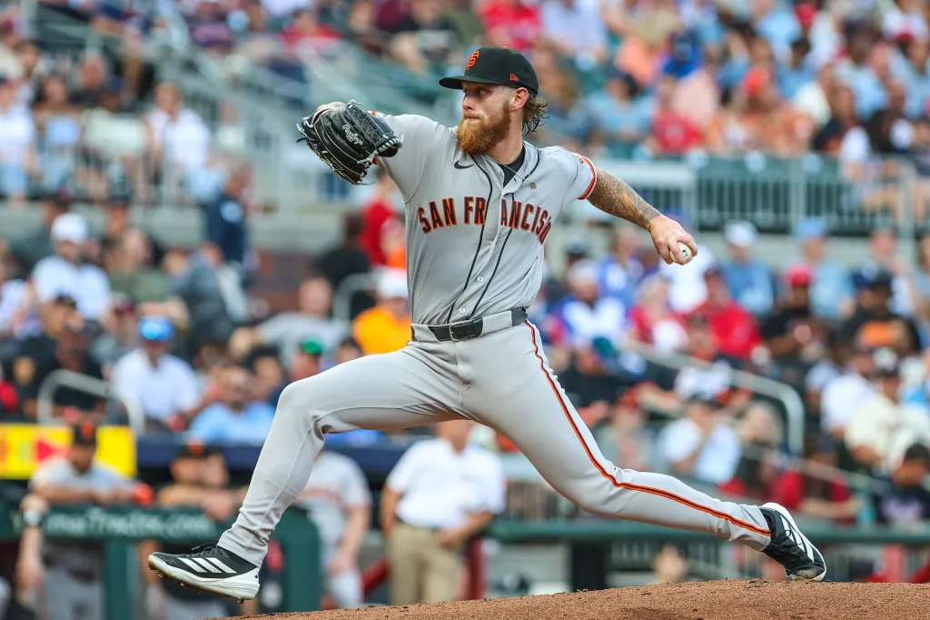 San Francisco Giants pitcher mid-pitch at a baseball game.
