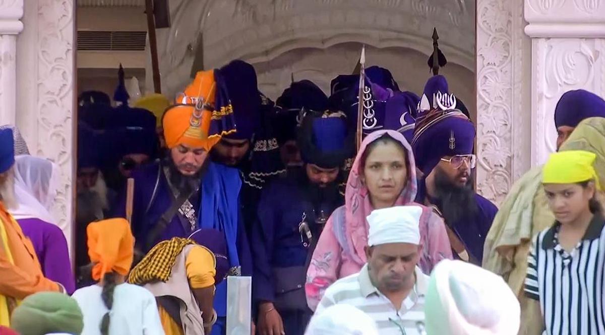 A group of Nihang Sikhs arrived at Gurdwara Paonta Sahib from Uttarakhand after meeting the administrations over their recent clash in Chamoli district’s Karnaprayag, in Paonta Sahib, Sirmaur, on Friday. (ANI Video Grab)