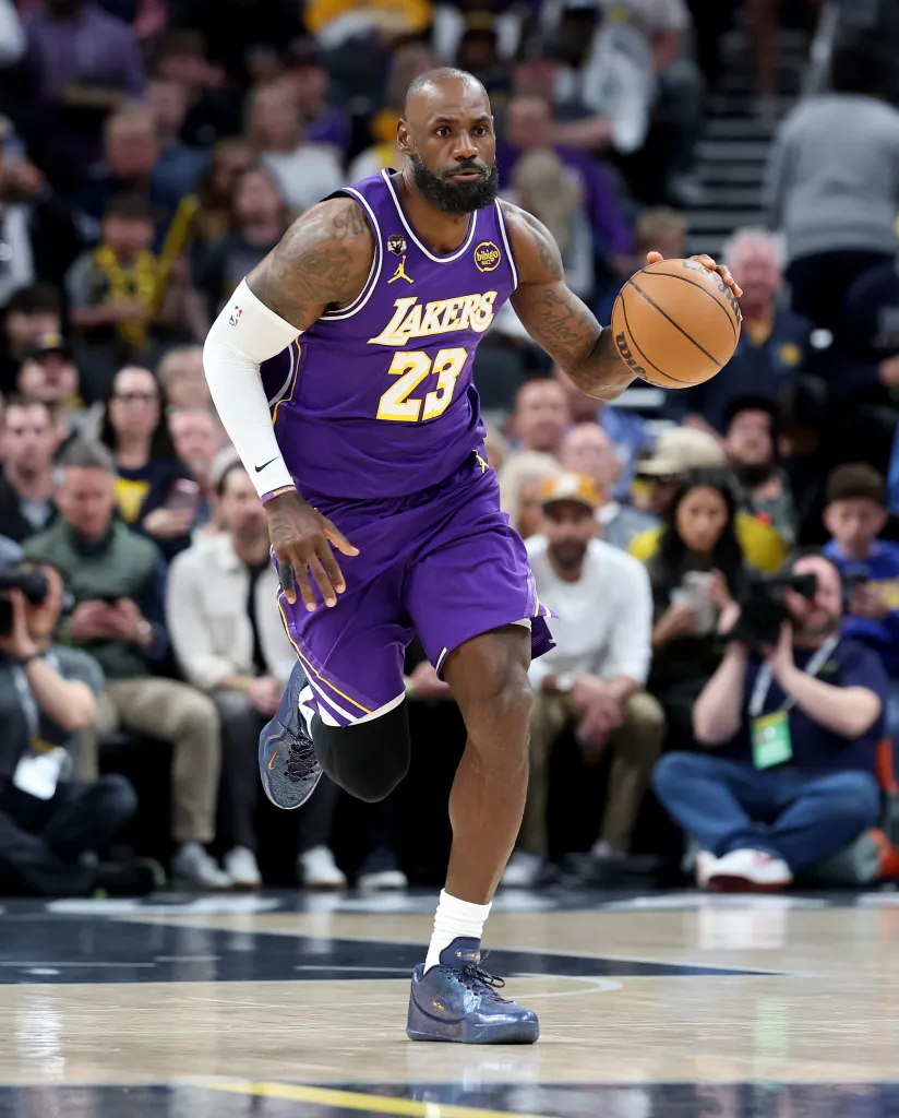 LeBron James dribbling a basketball on a court.