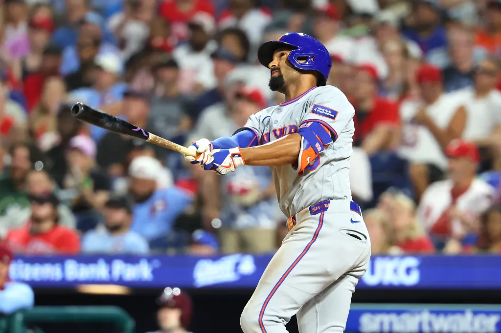 Marcus Semien #10 of the New York Mets hits a two-run triple in the seventh inning during the game against the Philadelphia Phillies at Citizens Bank Park on June 18, 2026 in Philadelphia, Pennsylvania.