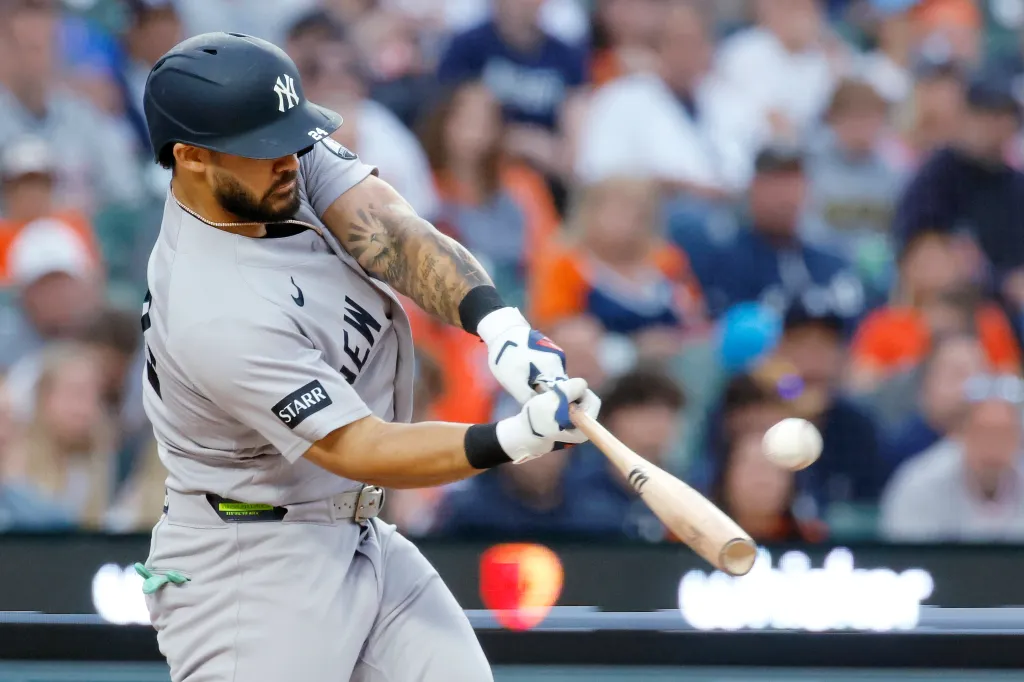 Jasson Dominguez #24 of the New York Yankees hits a two-run home run against the Detroit Tigers during the sixth inning at Comerica Park on June 24, 2026 in Detroit, Michigan. 