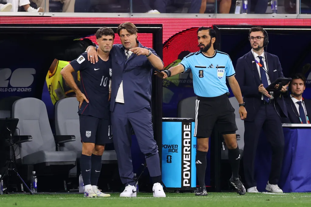 Mauricio Pochettino, Head Coach of the United States, speaks to Christian Pulisic #10 of the United States during the FIFA World Cup 2026 Group D match between Türkiye and USA at Los Angeles Stadium on June 25, 2026 in Inglewood, California. (