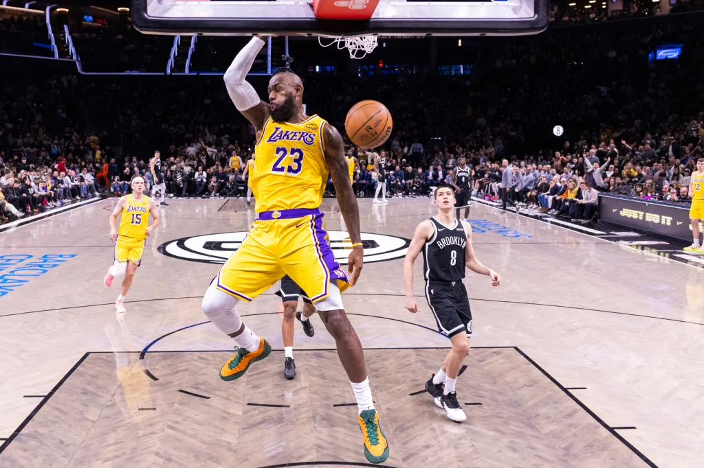 LeBron James #23 of the Los Angeles Lakers slams the ball during the first half against the Brooklyn Nets.