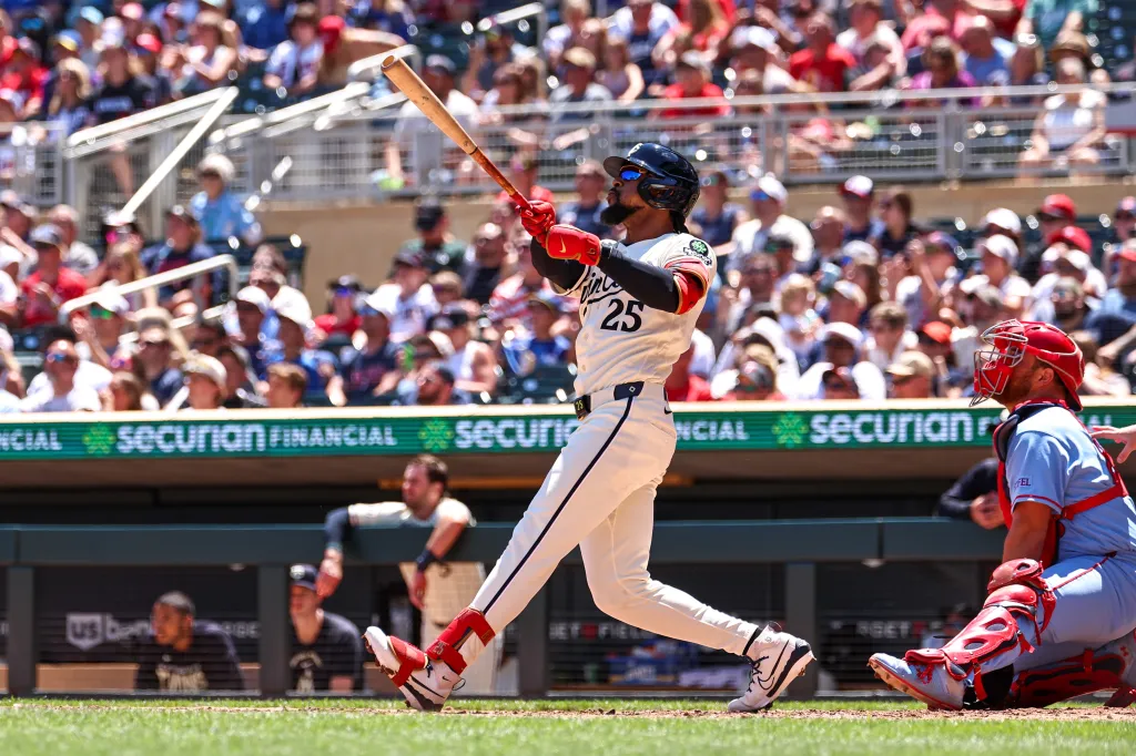 Byron Buxton, number 25 of the Minnesota Twins, hits a solo home run against the St. Louis Cardinals.