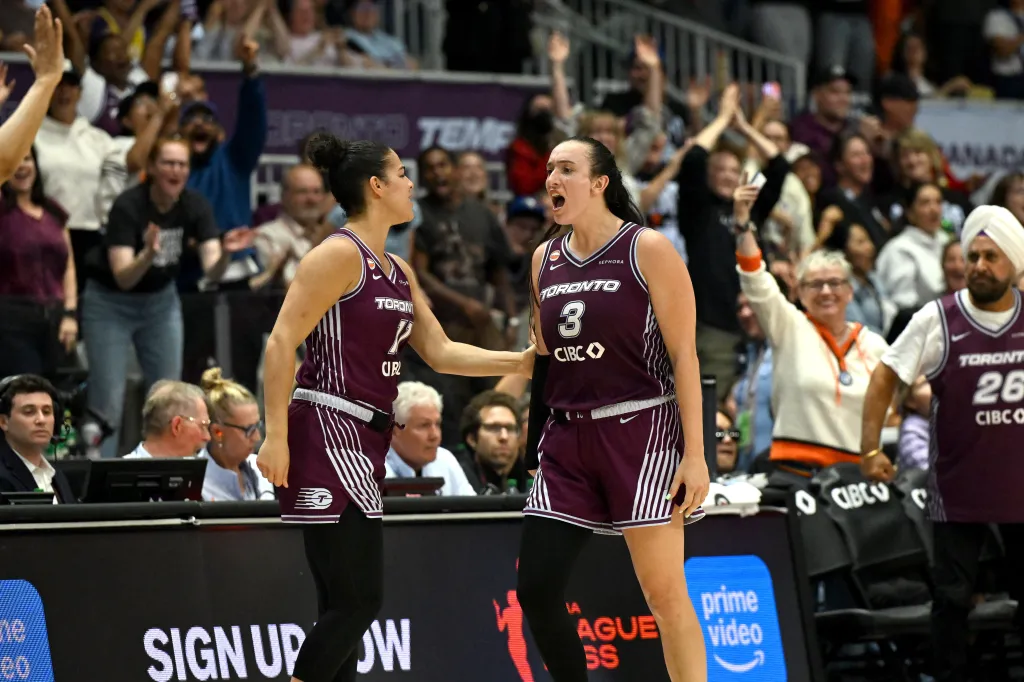 Toronto Tempo guard Marina Mabrey (3) is greeted by guard Kia Nurse (11) after making a basket against the Los Angeles Sparks.