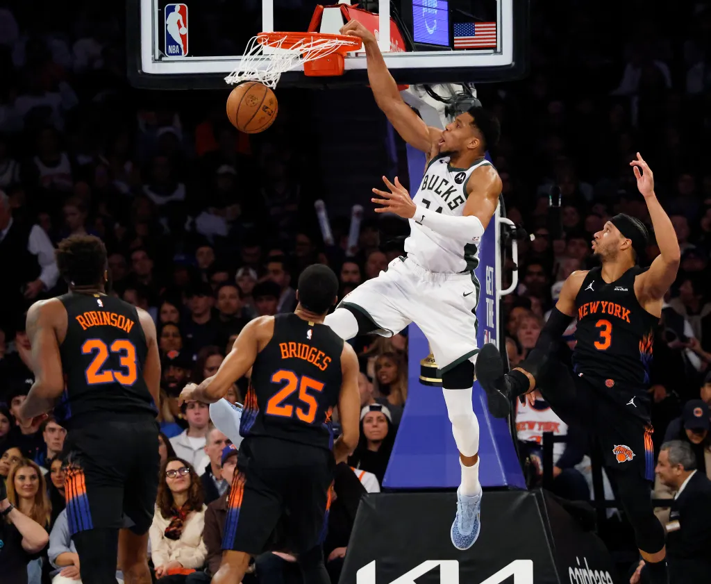 Giannis Antetokounmpo of the Milwaukee Bucks slams the ball.