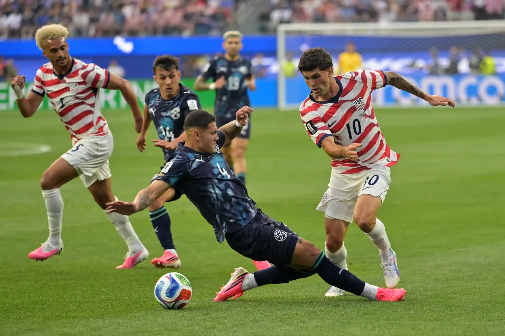 USMNT forward Christian Pulisic (10) challenges for the ball during a World Cup win over Paraguay on June 12, 2026.