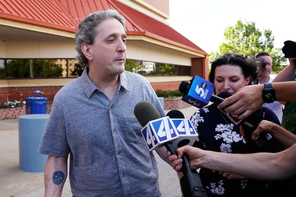 Former death row prisoner Richard Glossip, left, speaks to media after exiting a detention facility after being granted bond while awaiting retrial, May 14, 2026, in Oklahoma City.