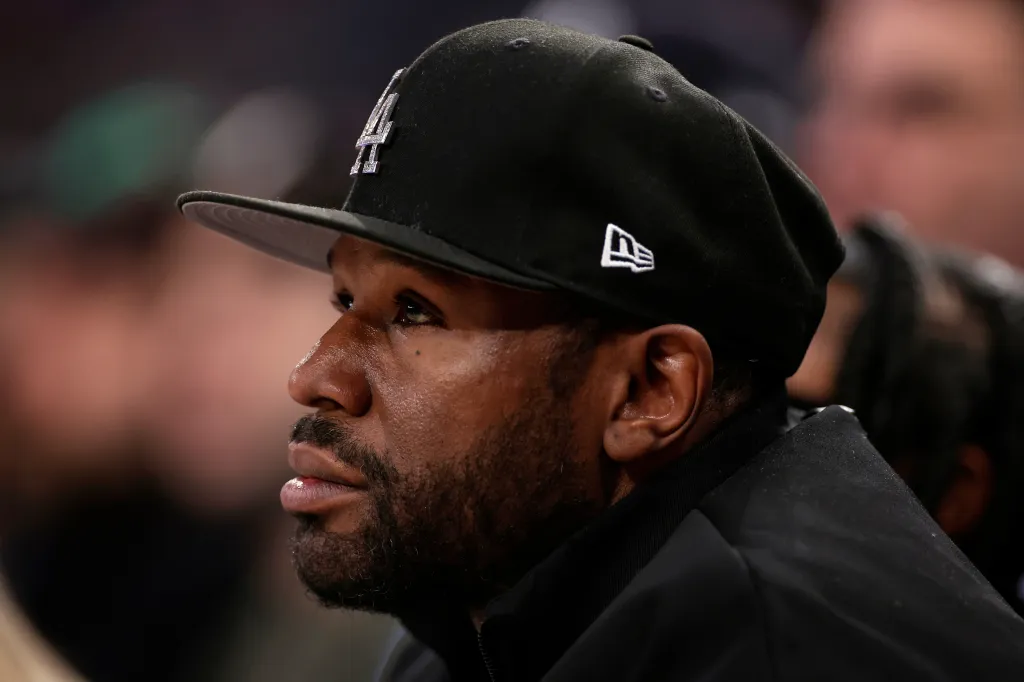Boxer Floyd Mayweather Jr. looks on during the first half of an NBA basketball game, March 26, 2025, in New York.