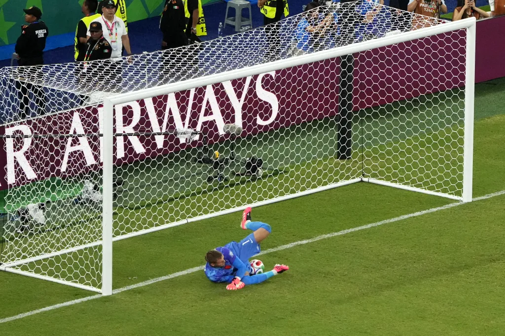 Bart Verbruggen knocks the ball into the net after appearing to save it during penalty kicks.