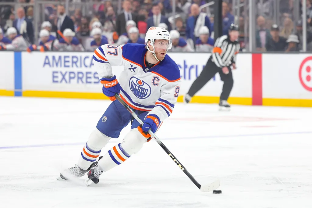 FILE - Edmonton Oilers center Connor McDavid moves the puck during the first period of an NHL hockey game against the Los Angeles Kings April 11, 2026 in Los Angeles. (AP Photo/Ryan Sun, File)