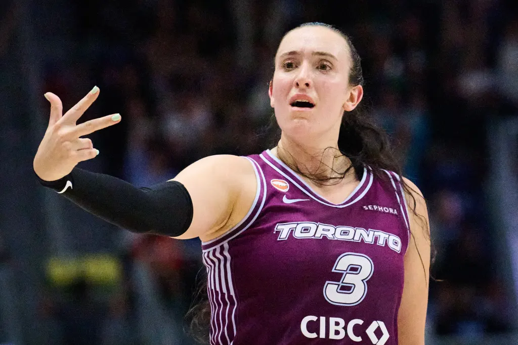 Toronto Tempo guard Marina Mabrey in a purple jersey with "Toronto" and number 3, signaling with her hand.