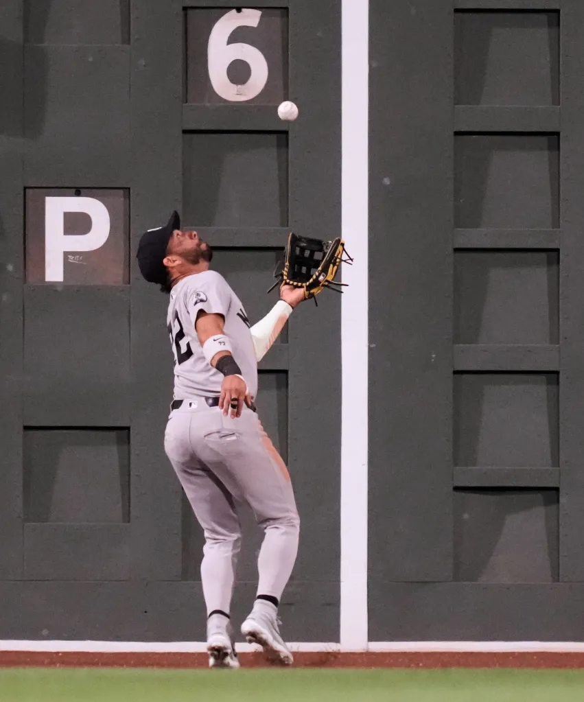 New York Yankees' José Caballero catches a flyout hit by Boston Red Sox's Wilyer Abreu during the seventh inning of a baseball game, Thursday, June 25, 2026, in Boston.
