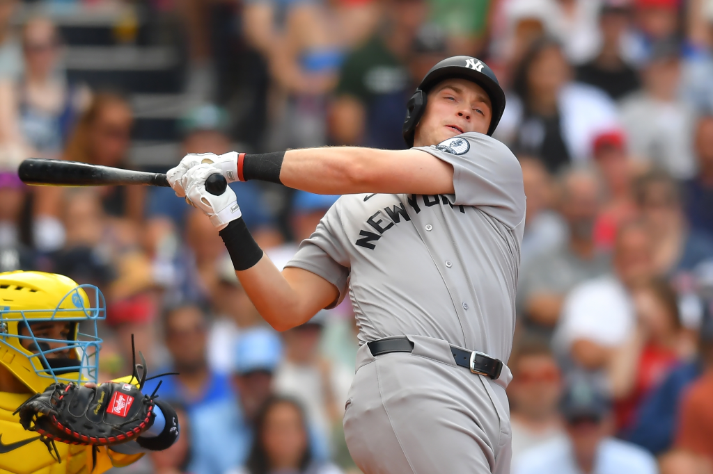 New York Yankees' Ben Rice, right, strikes out swinging in front of Boston Red Sox catcher Carlos Narváez, left, in the ninth inning of a baseball game, Saturday, June 27, 2026, in Boston. 