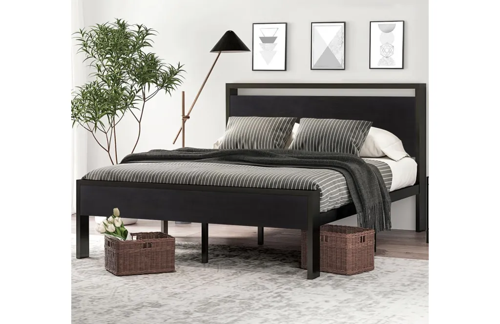 Black platform bed with striped bedding.