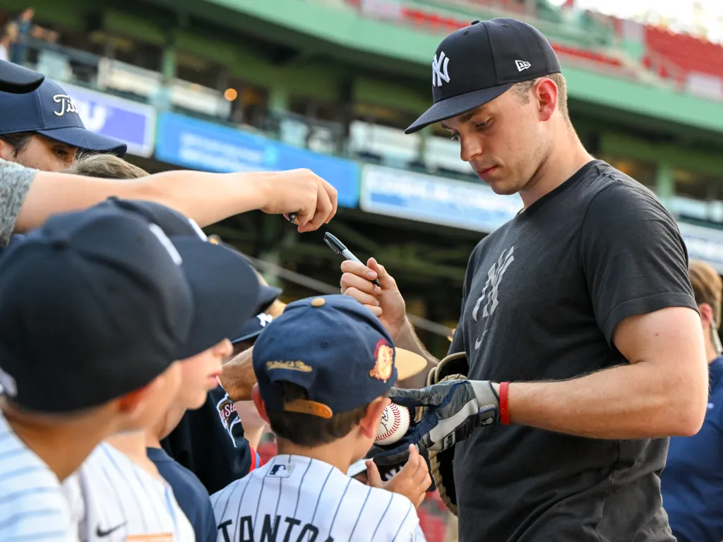 Ben Rice signs autographs for fans before the Yankees' loss to the Red Sox on June 25, 2026.