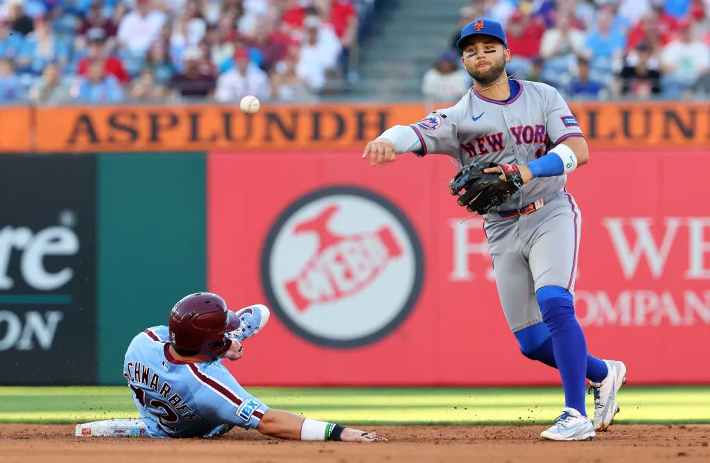 Bo Bichette throws to first base after a fielder's choice force out at second base in the first inning of the Mets' 6-4 win over the Phillies on June 18, 2026 at Citizens Bank Park.
